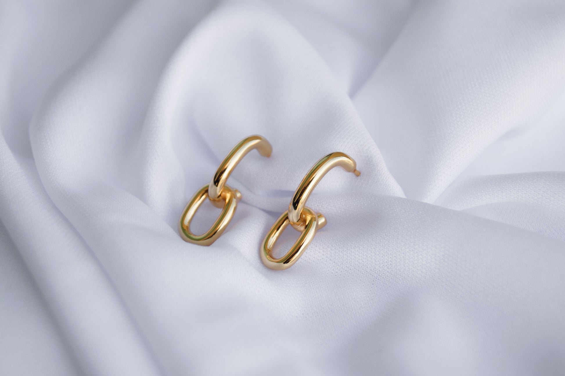 aretes eslabones largos enchapados en oro en plata ley dosce joyeria waterproof